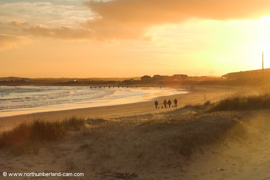 Walkers at sunset.